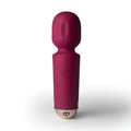 A sleek magenta rocks off rechargeable silicone mini wand with 16 modes and textured grip in azalea red
