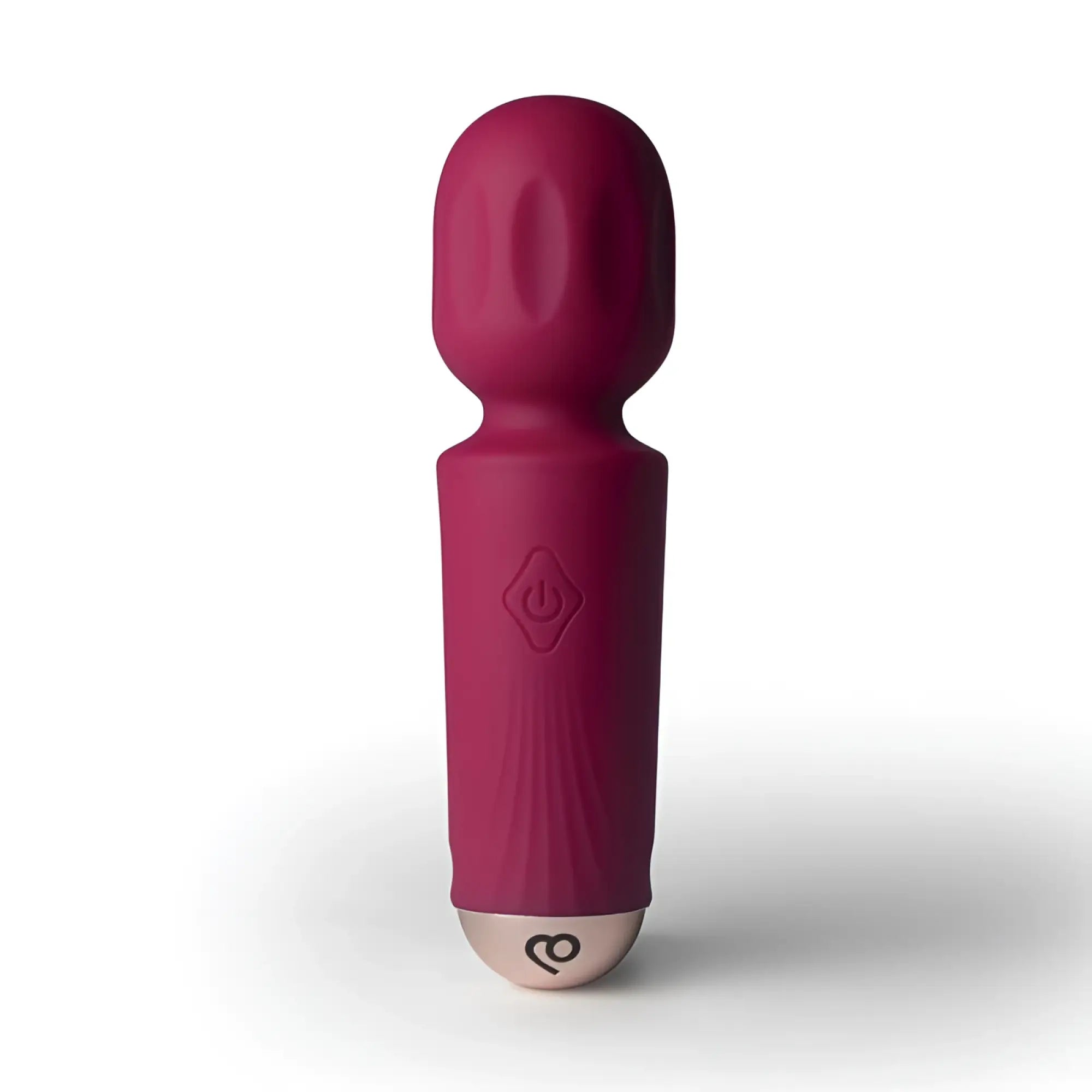 A sleek magenta rocks off rechargeable silicone mini wand with 16 modes and textured grip in azalea red