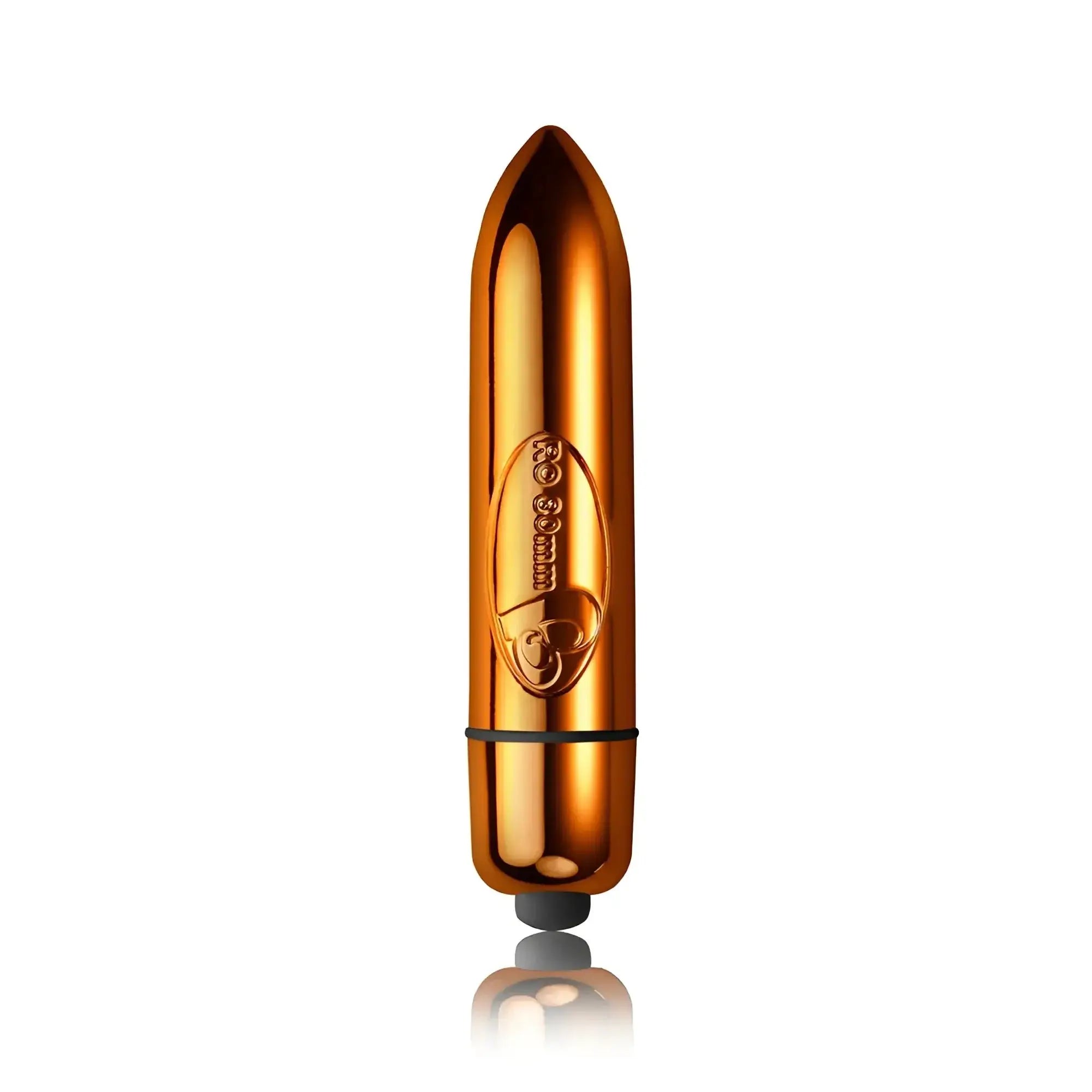 Shiny gold-colored bullet-shaped rocks off ro-80 single speed copper electronic toy with black rubber tip and engraved logo