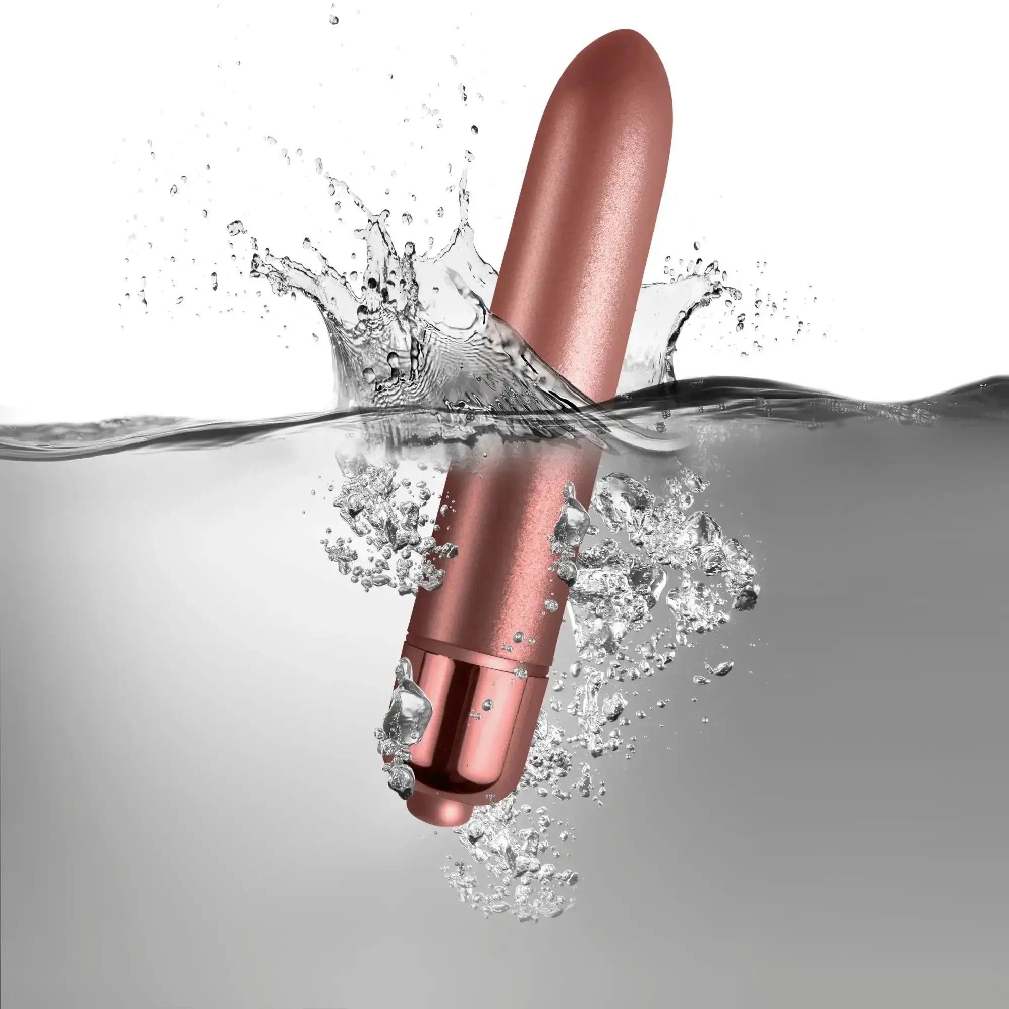 A sleek rose gold cylindrical vibrator with smooth glossy finish and rounded ends rocks off RO-90 touch of velvet