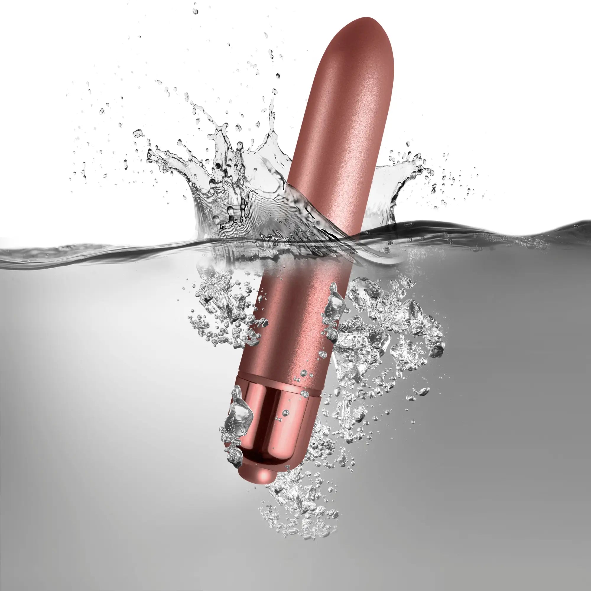 A sleek rose gold cylindrical vibrator with smooth glossy finish and rounded ends rocks off RO-90 touch of velvet