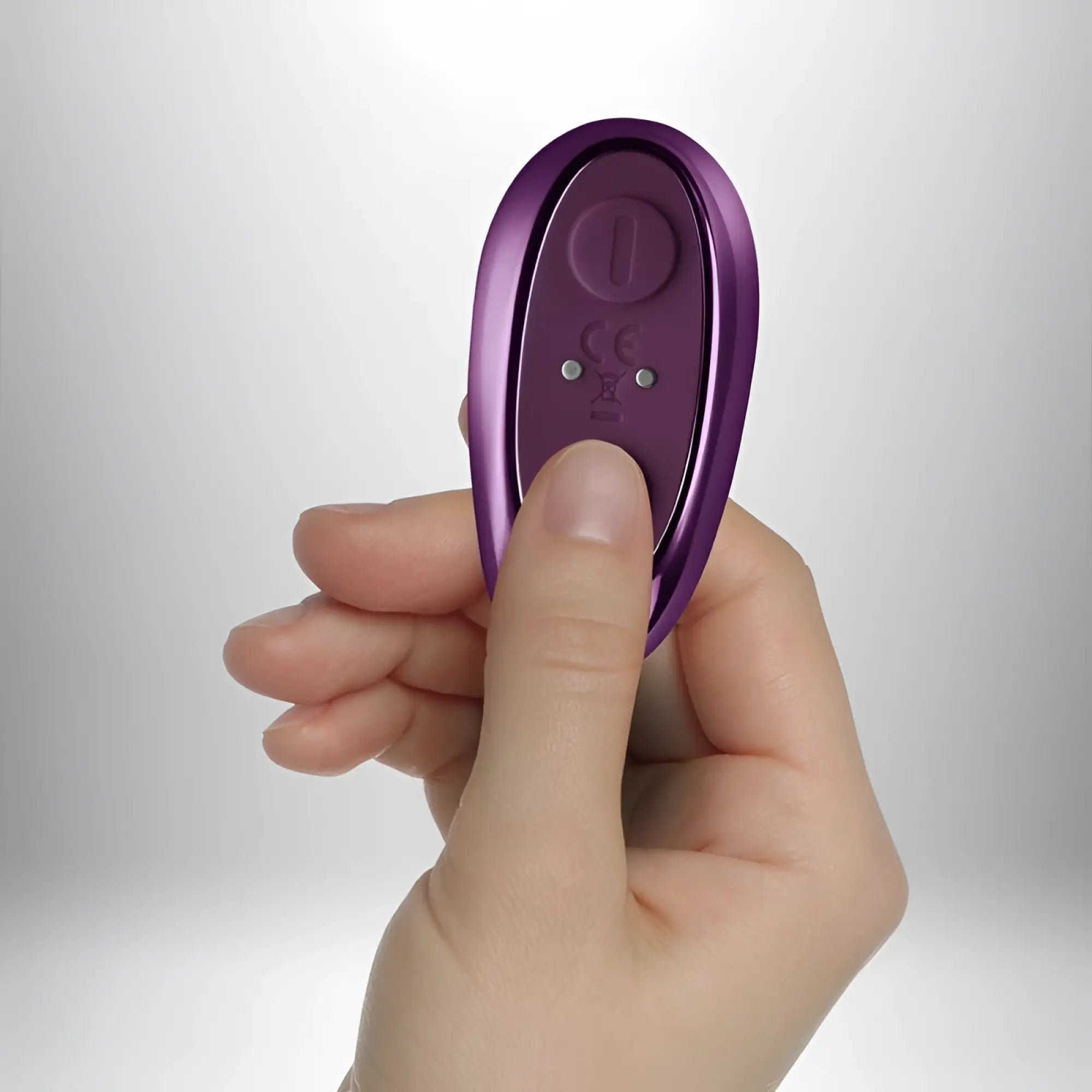 Purple metallic remote control with circular power button and ce markings for rocks off rock chick diva vibrator