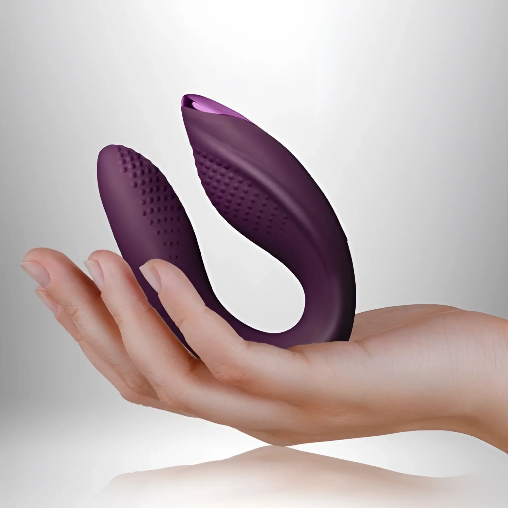 Purple silicone dual-headed vibrator with textured surfaces and ergonomic design rocks off rock chick diva