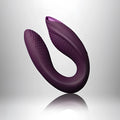 Purple silicone u-shaped vibrator rocks off rock chick diva with textured grip surfaces and smooth curved design