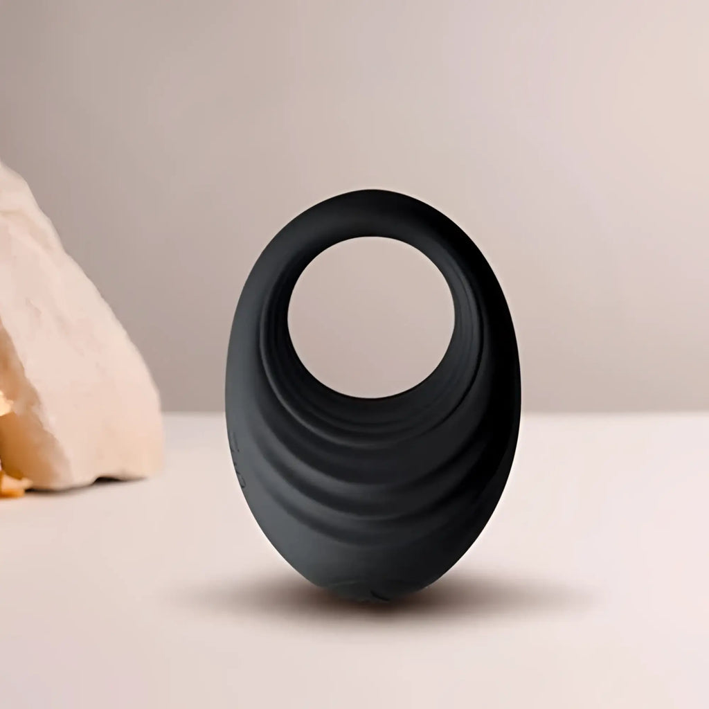 Black silicone vibrating cock ring with concentric ridges rocks off spire 10 speed for enhanced pleasure