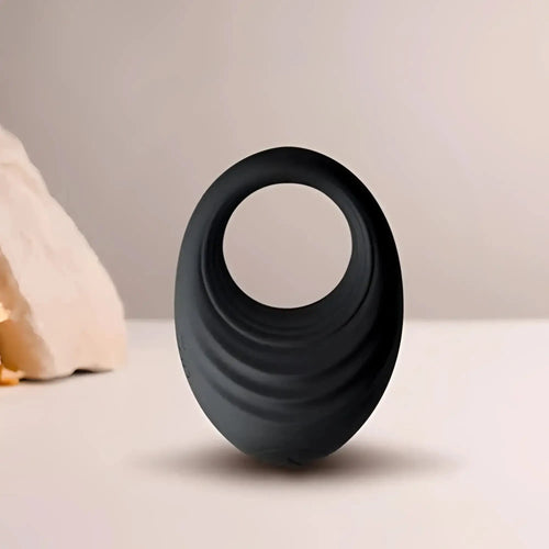 Black silicone vibrating cock ring with concentric ridges rocks off spire 10 speed for enhanced pleasure