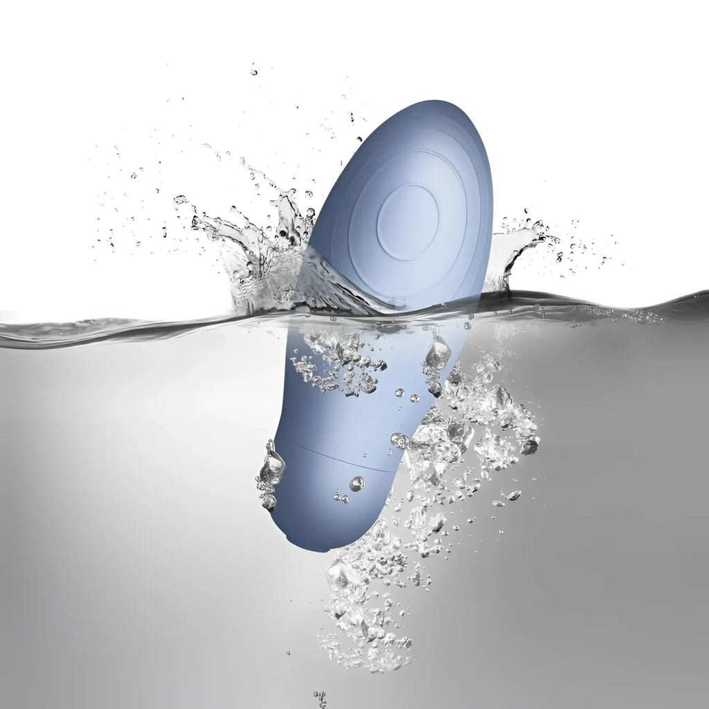 A sleek light blue silicone egg shaped Rocks Off SugarBoo Blue Bae Layon massager with glossy finish and circular patterns