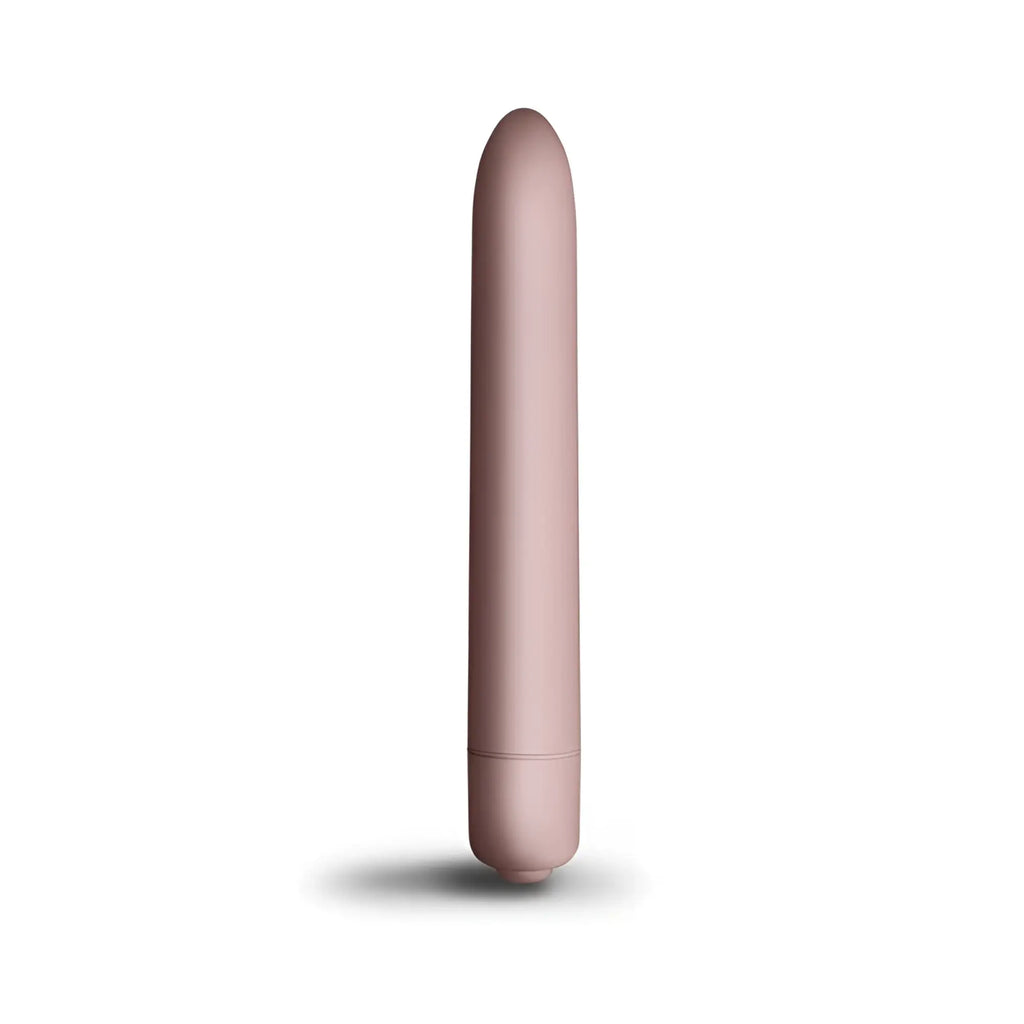A sleek matte rose gold cylindrical vibrator with smooth rounded design rocks off sugarboo bullet vibe blush