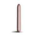 A sleek matte rose gold cylindrical vibrator with smooth rounded design rocks off sugarboo bullet vibe blush