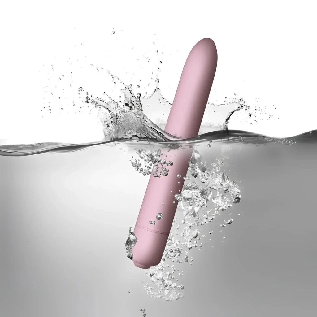 A sleek matte pink cylindrical Rocks Off SugarBoo Bullet Vibe with a smooth rounded design for personal use