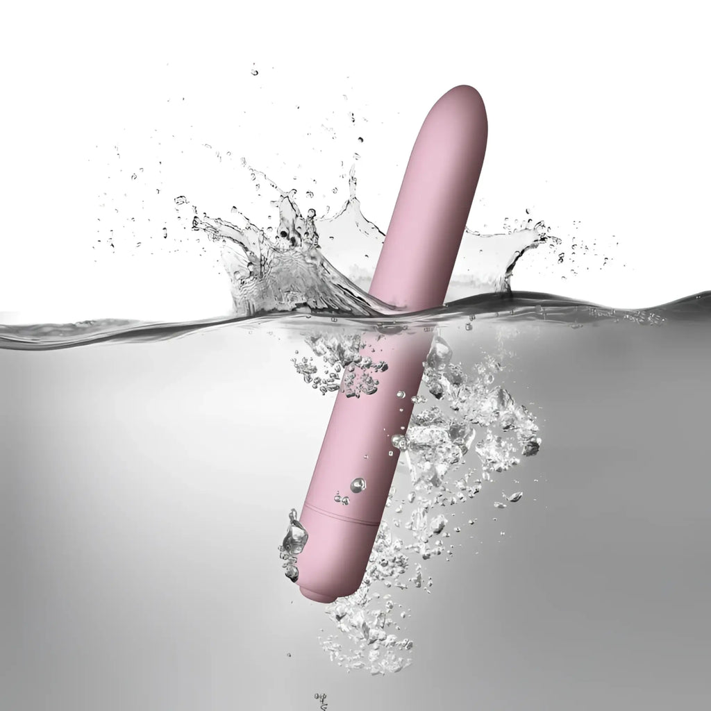 A sleek matte pink cylindrical Rocks Off SugarBoo Bullet Vibe with a smooth rounded design for personal use