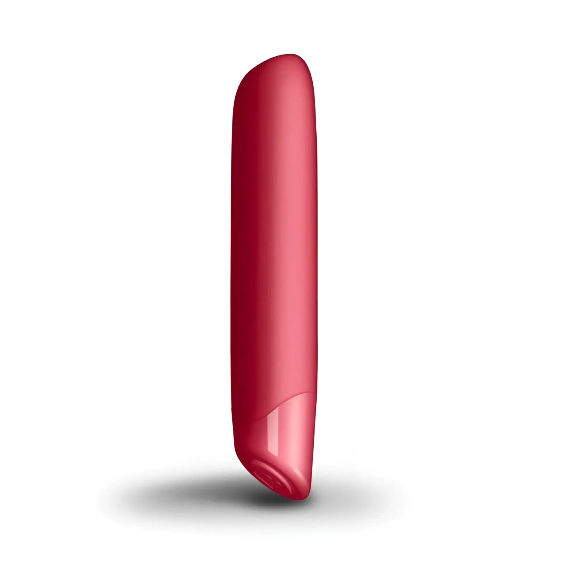 A sleek glossy red cylindrical rocks off sugarboo cool coral bullet vibe with a smooth rounded top and tapered bottom