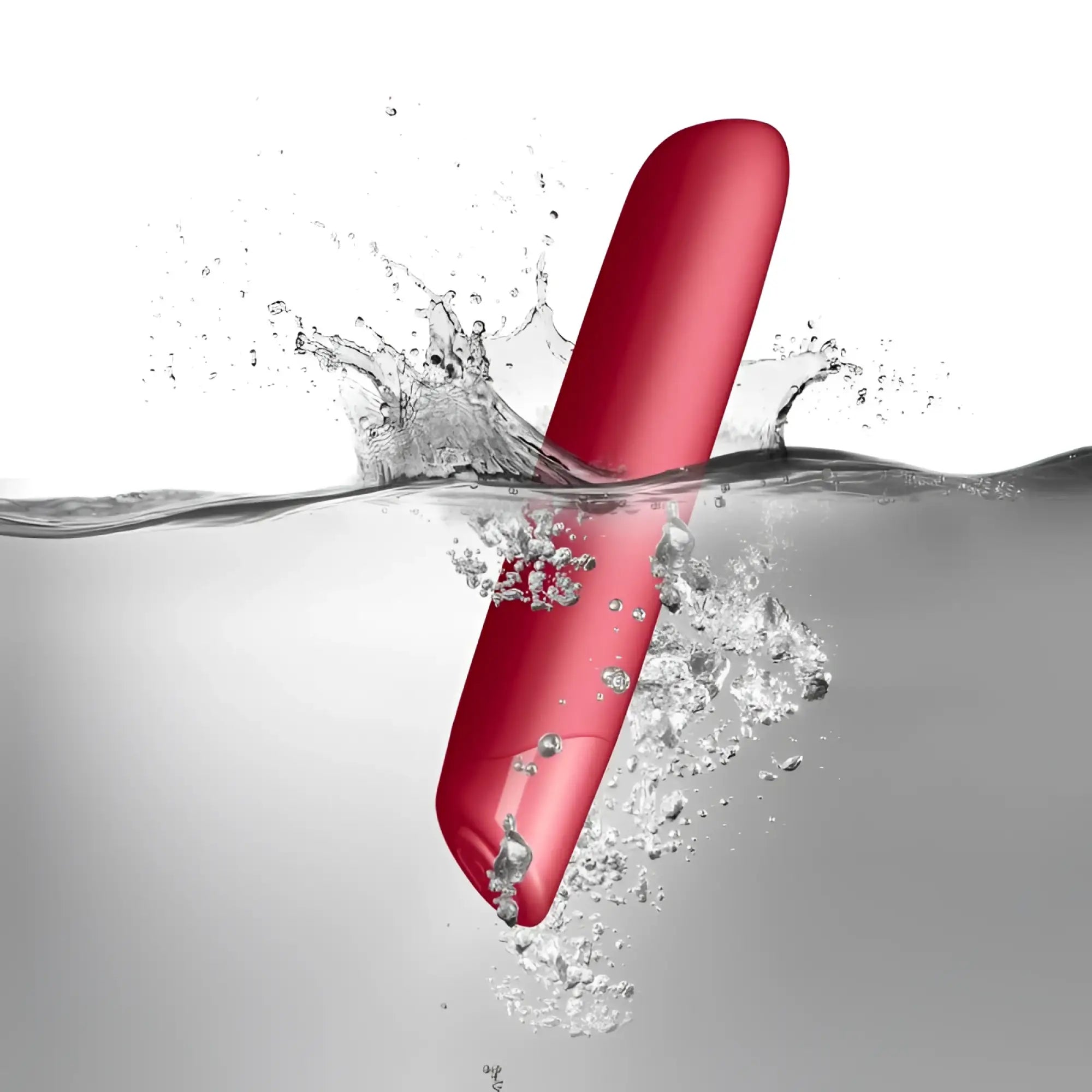 A sleek vibrant red silicone vibrator with a smooth glossy finish rocks off sugarboo cool coral bullet vibe