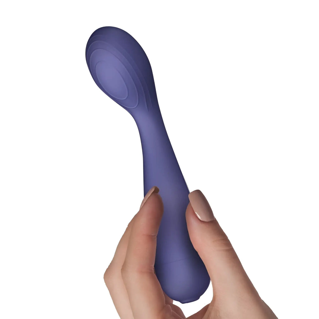 A sleek matte purple silicone wand vibe with a curved handle and rounded head from rocks off sugarboo peri berri