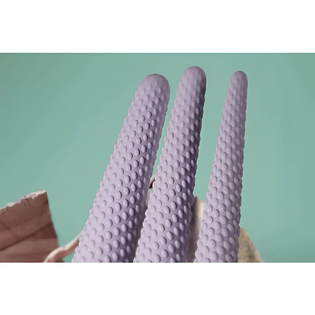 Lavender silicone gloves with a textured bumpy surface from the rocks off unite 3 pc silicone dilator set
