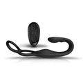 Black silicone remote-controlled vibrator with curved design and looped handle for cock ball and anal use