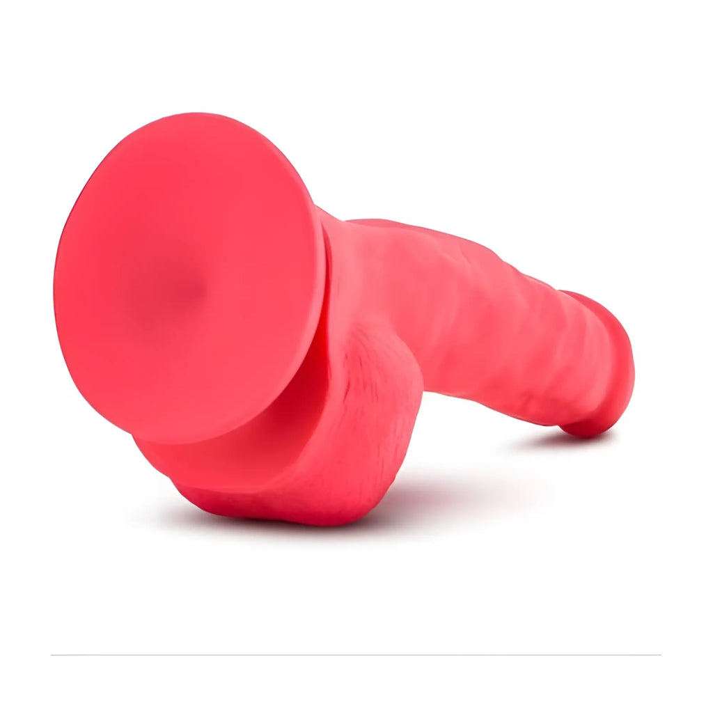 Red silicone suction cup dildo with textured ribbed shaft and rounded head from ruse shimmy cherise dong