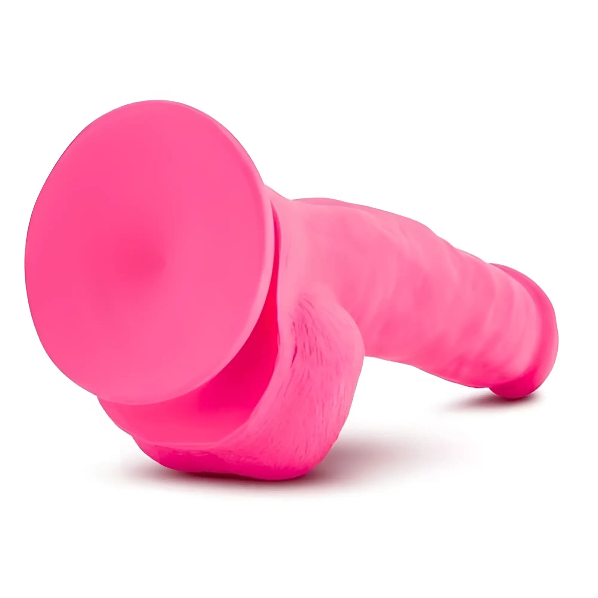 Bright pink silicone ruse ruse shimmy hot pink dong with suction cup base and textured surface for secure use