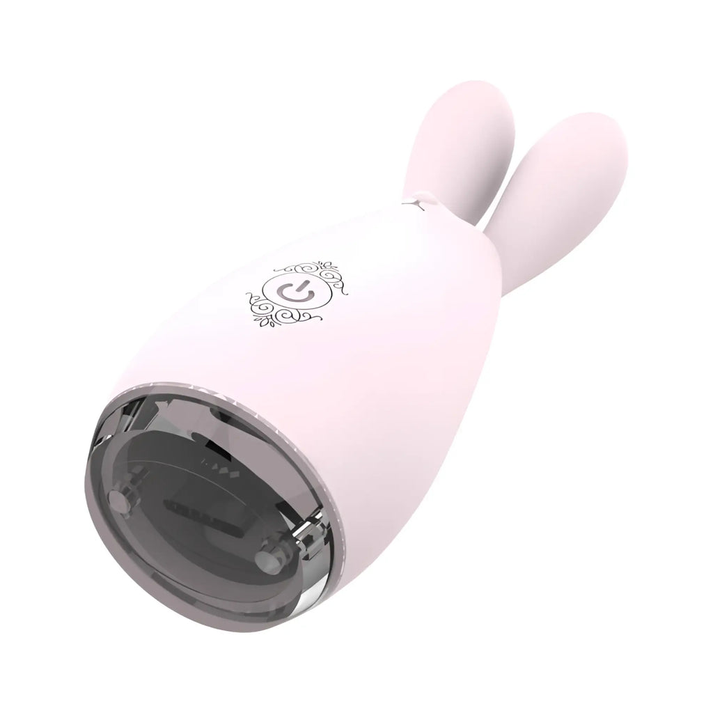 Pink s-hande reba massager orchid with smooth plastic body shaped like a bunny and a clear circular base