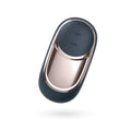 A sleek modern remote control with a dark navy silicone body and rose gold metal accents for satisfyer layon 2 dark desire