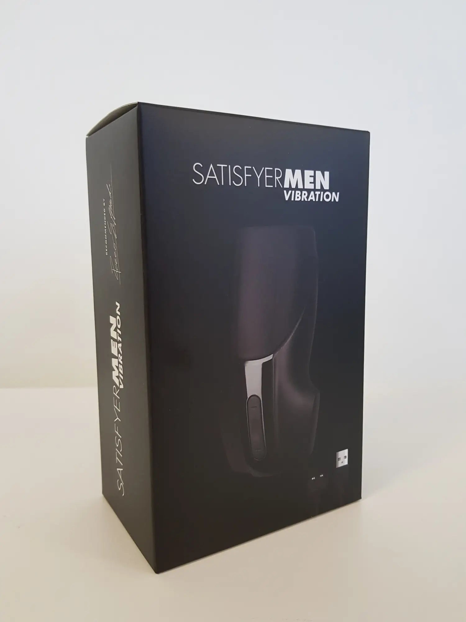 Black satisfyer men vibration device box with sleek modern design and silver accent details for discreet use