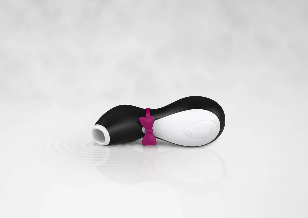 Satisfyer Satisfyer Penguin black and white penguin-shaped toy with magenta bow tie for personal pleasure use
