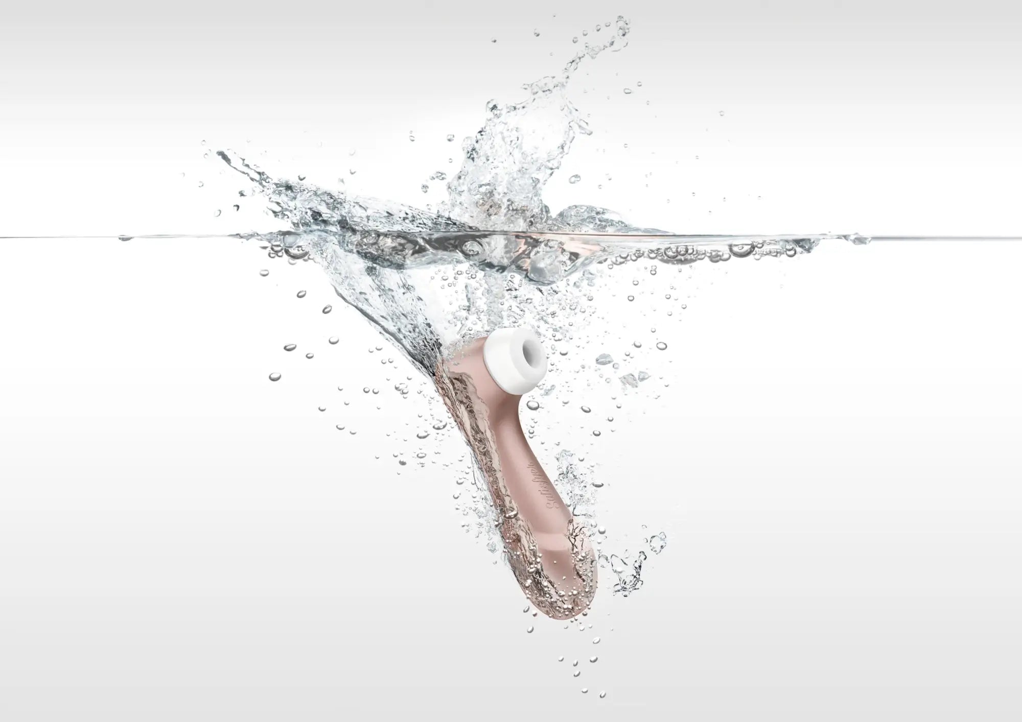 Rose gold satisfyer pro 2 g2 air pulse clitoral stimulator with white silicone head partially submerged in water