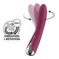 A sleek magenta satisfyer spinning vibe 1 adult toy with a metallic silver tip and smooth curved design