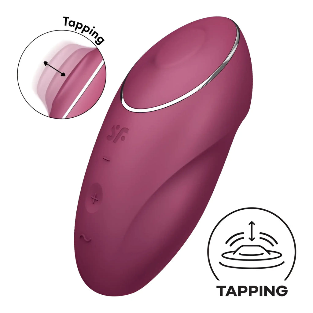 A sleek matte burgundy satisfyer tap and climax 1 red adult toy with silver accent ring and textured control buttons