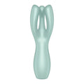 A sleek matte mint-green scalp massager with ergonomic design and three curved prongs by satisfyer