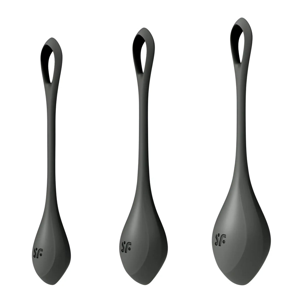 Three matte black silicone spoon shaped satisfyer yoni power balls with looped handles and sf logo engraved on base