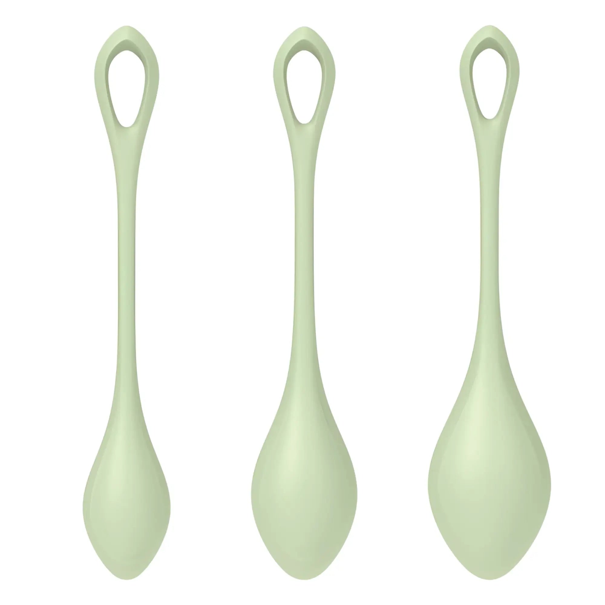 Three pale green silicone spoons with sleek rounded handles and oval bowls in the satisfyer yoni power balls 2 set