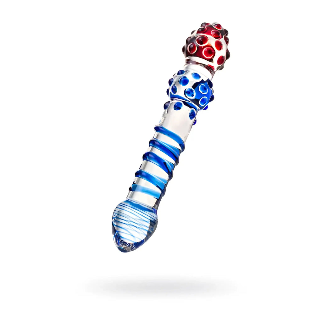 A clear glass dildo with blue spiral patterns and red gemstone accents from Sexus Glass measuring 20.5cm