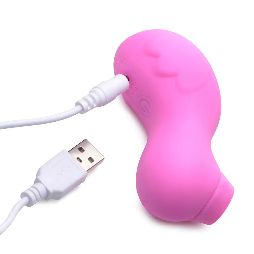Pink silicone shegasm sucky ducky clitoral stimulator with usb charging cable attached