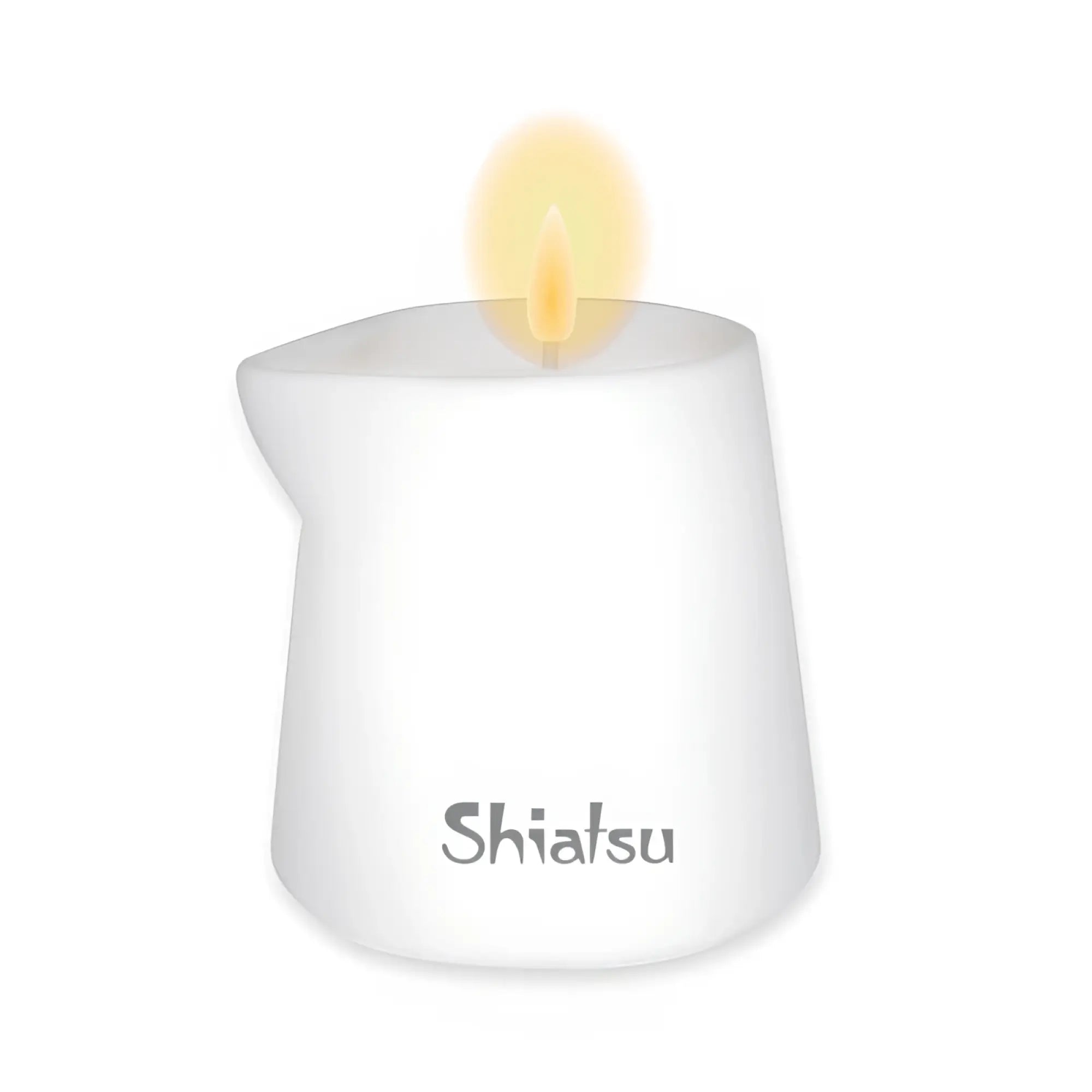 White shiatsu massage candle in a glass container with a lit flame scented with patchouli