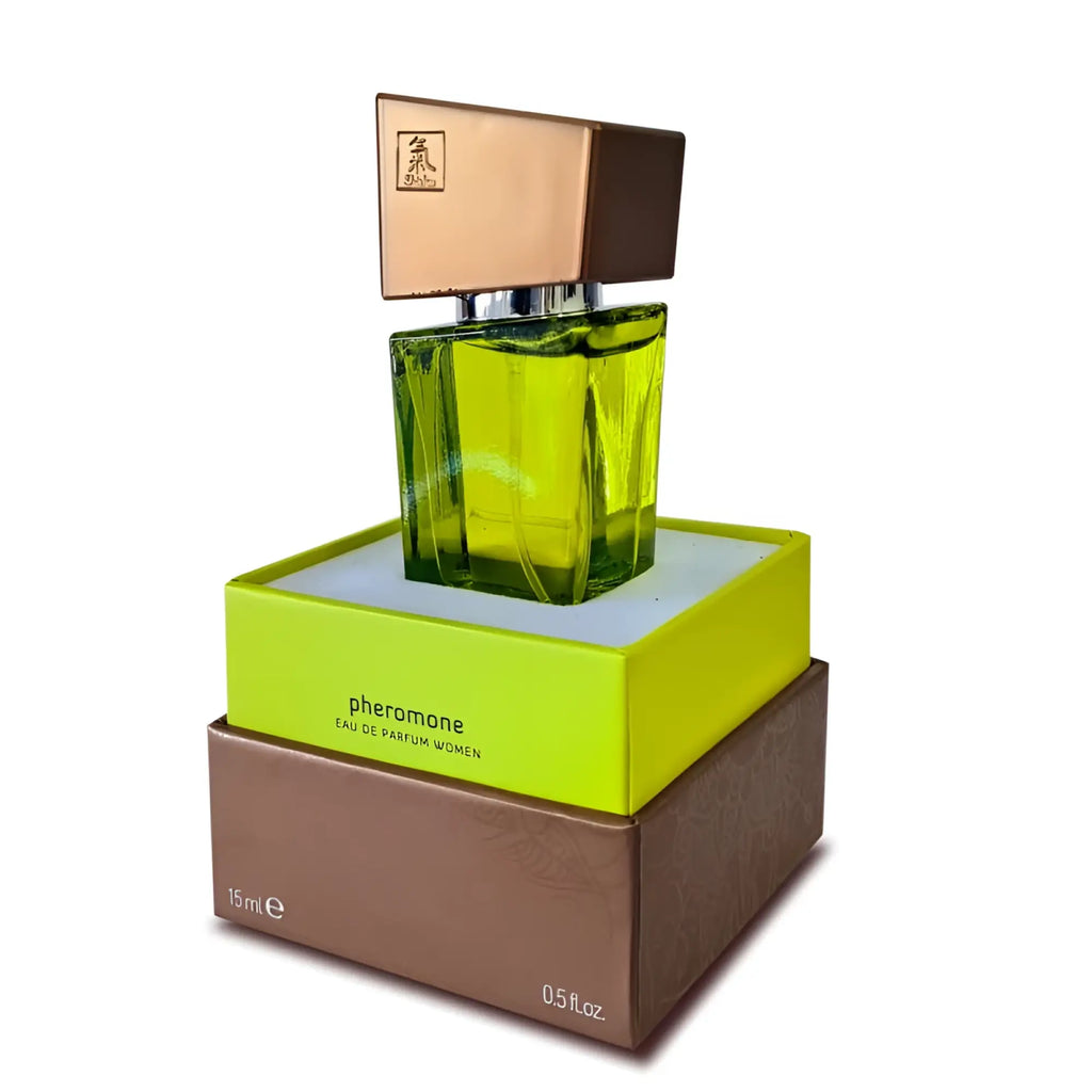 A vibrant lime-green faceted glass perfume bottle with rose-gold cap in shiatsu pheromone fragrance woman lime packaging