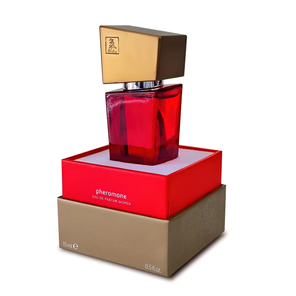 A striking red glass Shiatsu Shiatsu pheromone fragrance woman bottle with a gold and black square cap in branded packaging