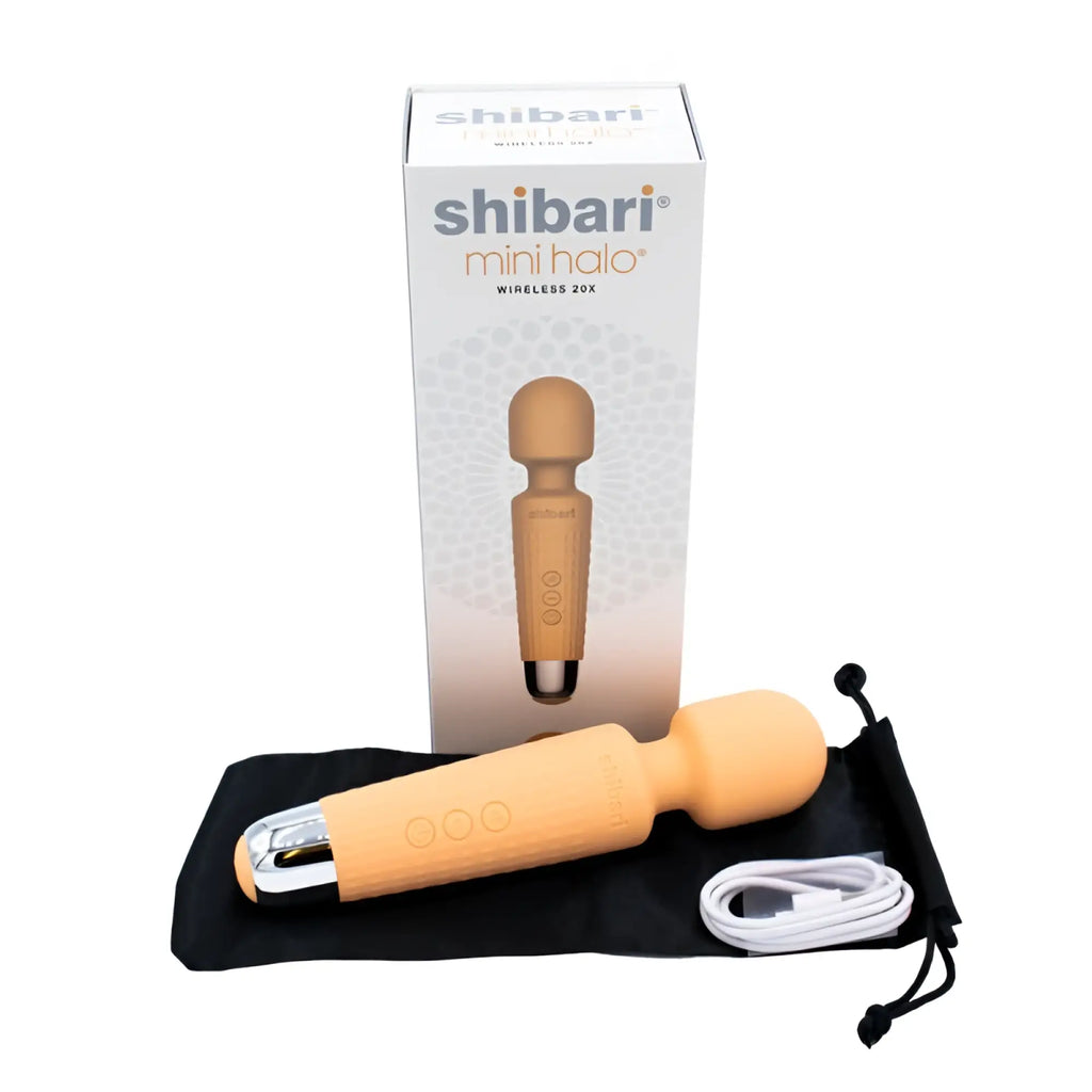 The shibari mini wand halo 20x peach is a sleek silicone and metal wand with three tactile buttons on its handle