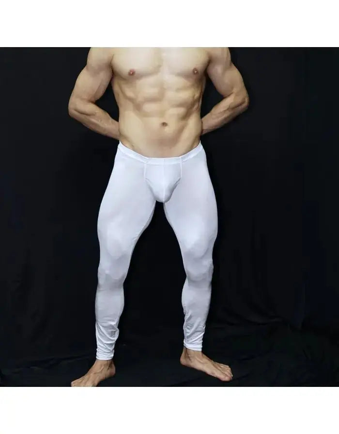 Men's shiny white gym tights by Arroyman featuring a snug fit and smooth fabric shown on a model with bare skin.