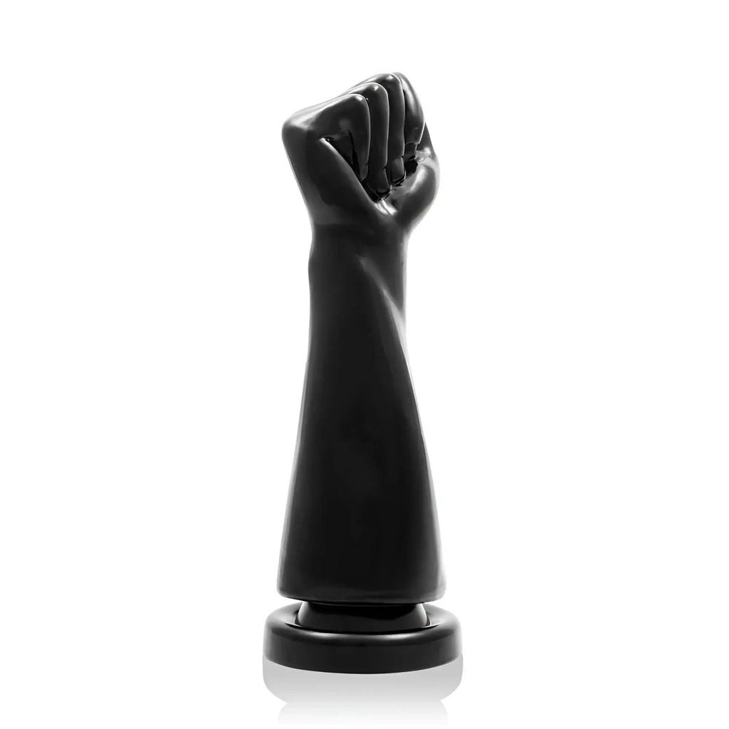 Si novelties the rebel fist black is a black glossy resin fist sculpture on a circular base for display use