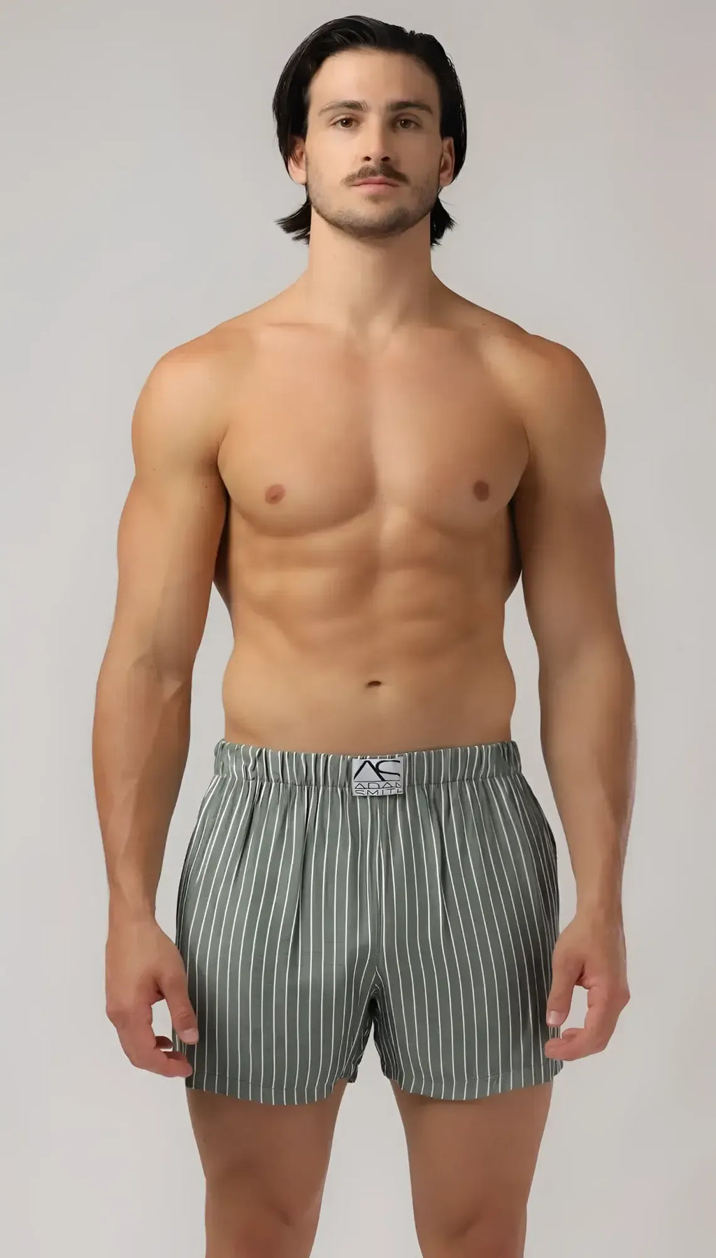 Menâs gray and white vertically striped side pocket relax boxers with branded elastic waistband for comfort and style