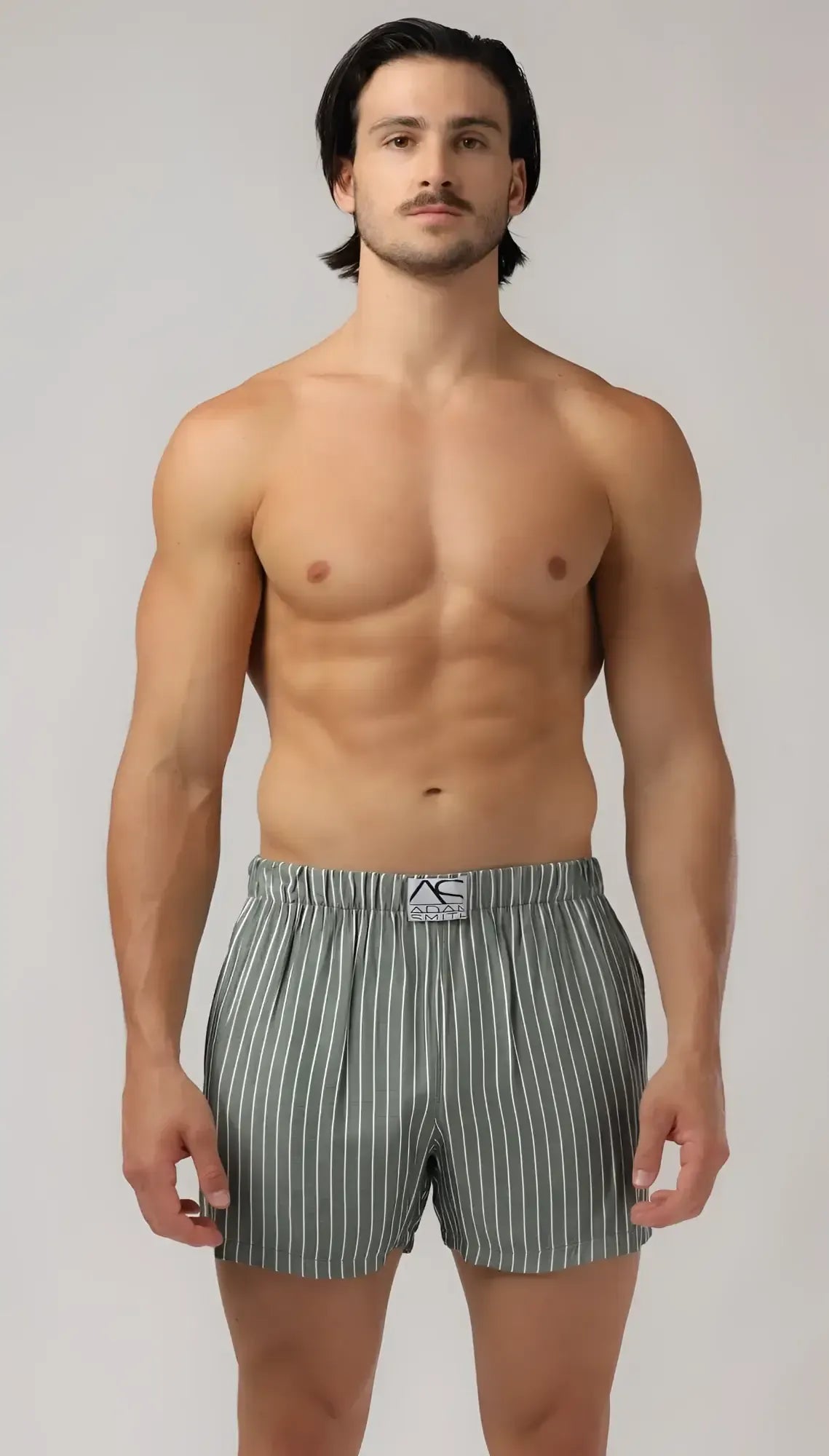 Menâs gray and white vertically striped side pocket relax boxers with branded elastic waistband for comfort and style