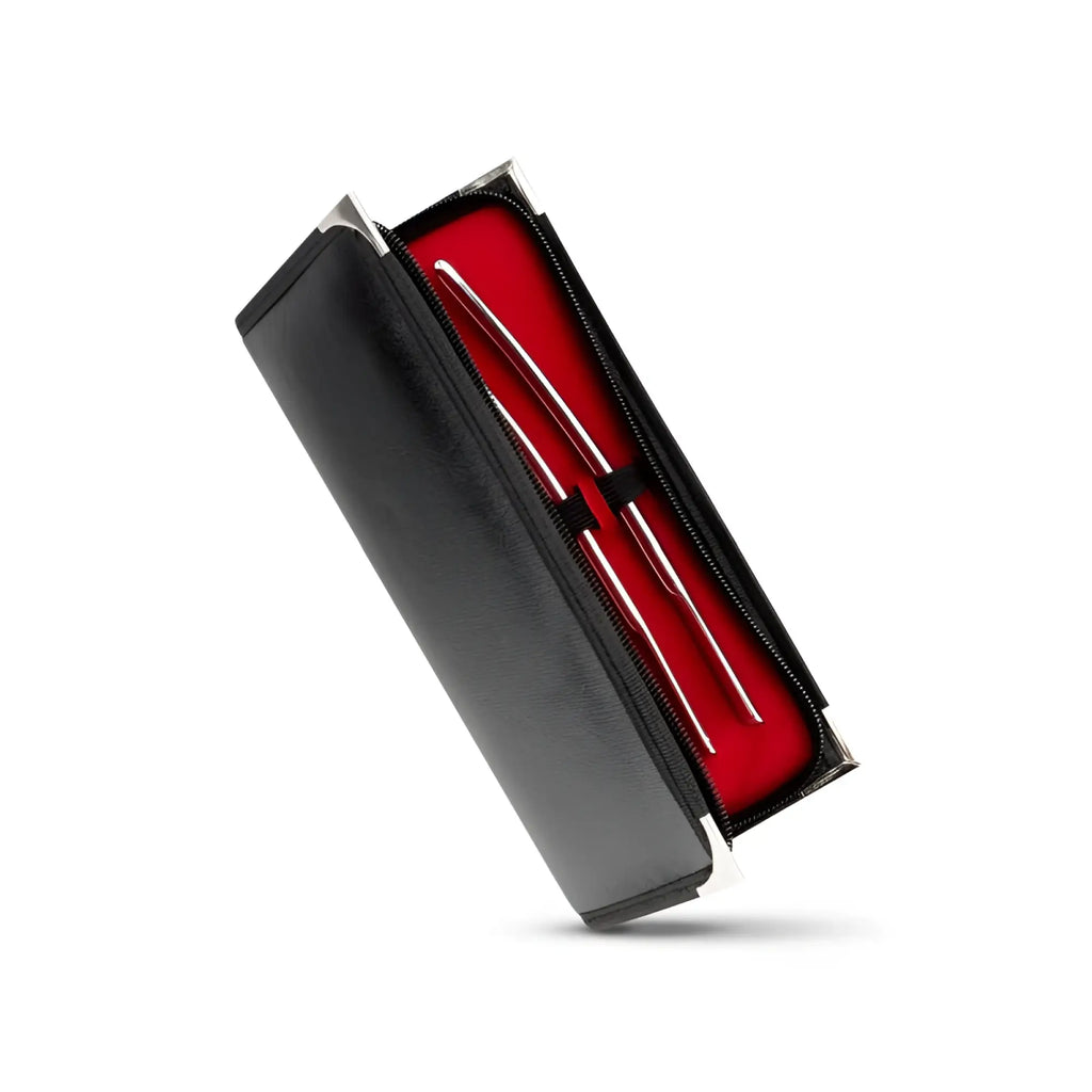 Black leather case with silver zipper holding two polished metal ear picks in red interior for sinner single ended dilator trainer set
