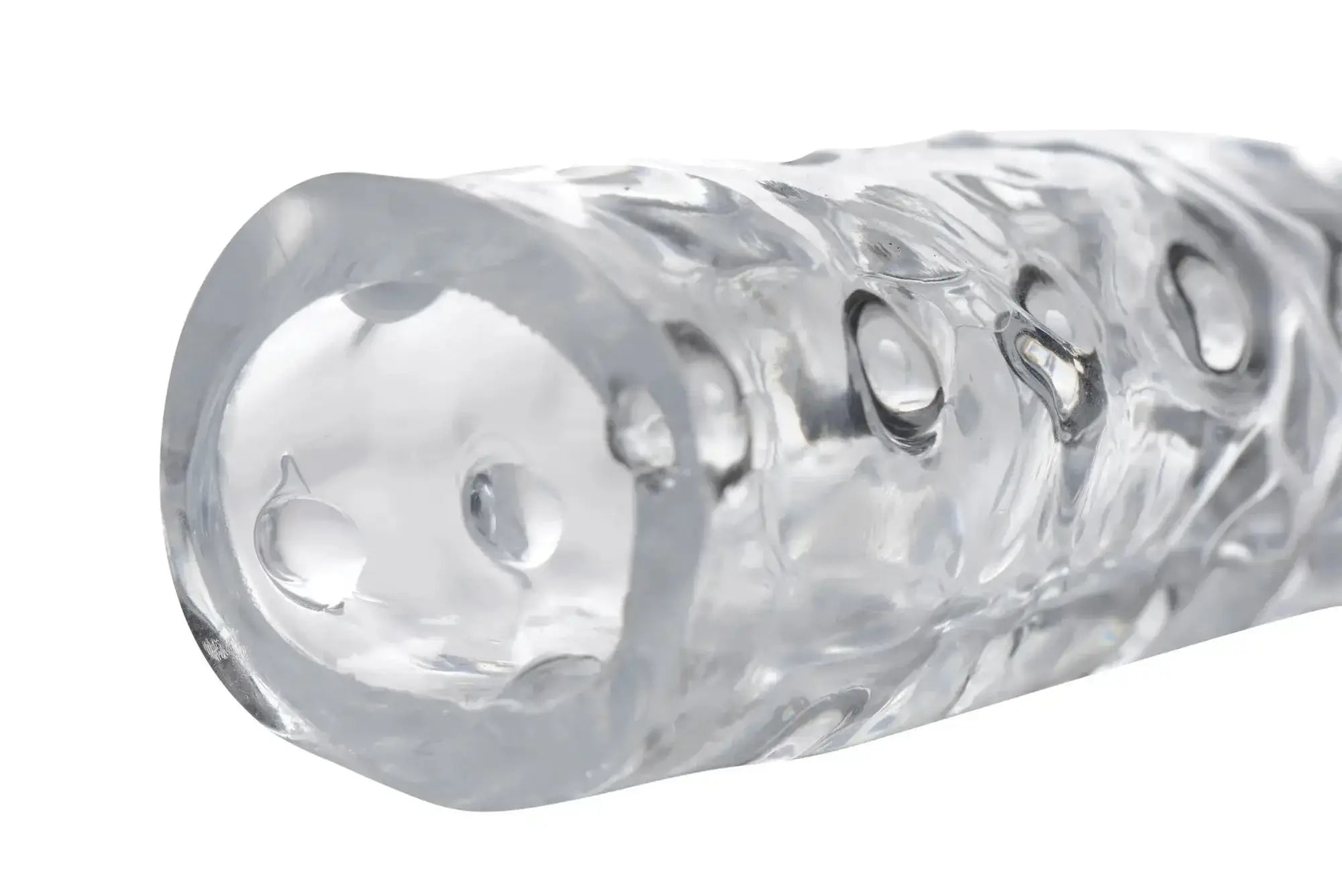 Size Matters 3in clear penis enhancer sleeve made of textured silicone with embossed circular patterns and glossy finish