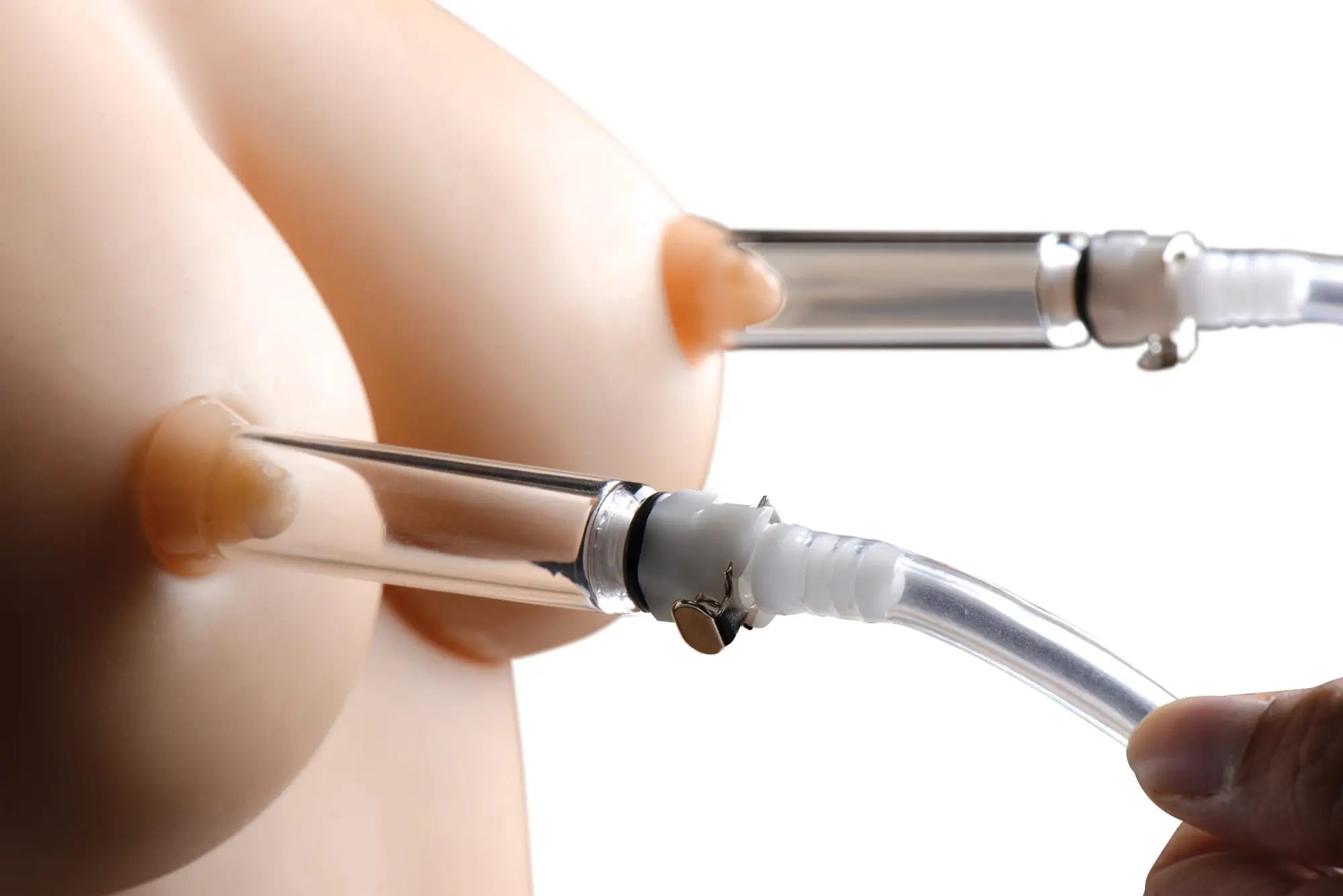 Clear plastic Size Matters nipple pumping system with dual cylinders metallic parts and white flexible tube shown from back