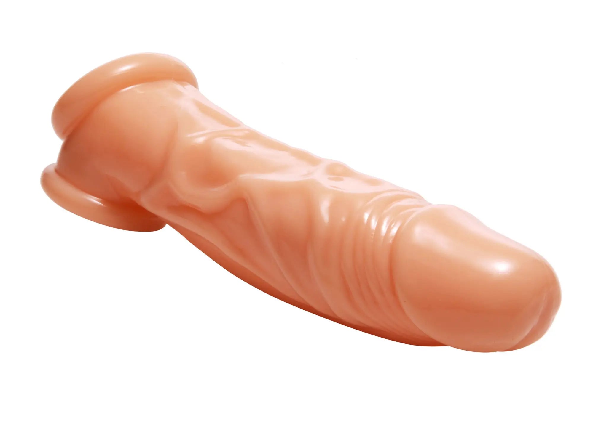 Peach-colored silicone dildo with realistic textured surface and rounded head from size matters penis enhancer and ball stretcher