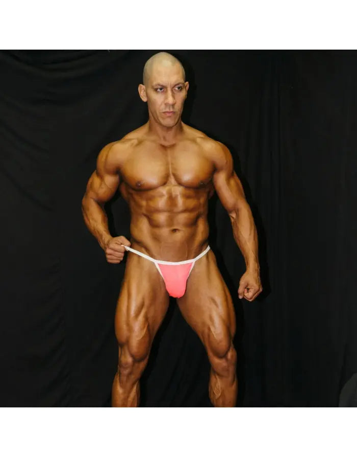 Neon pink bikini underwear with white waistband shown on a model by Arroyman highlighting a snug fit and vibrant color.