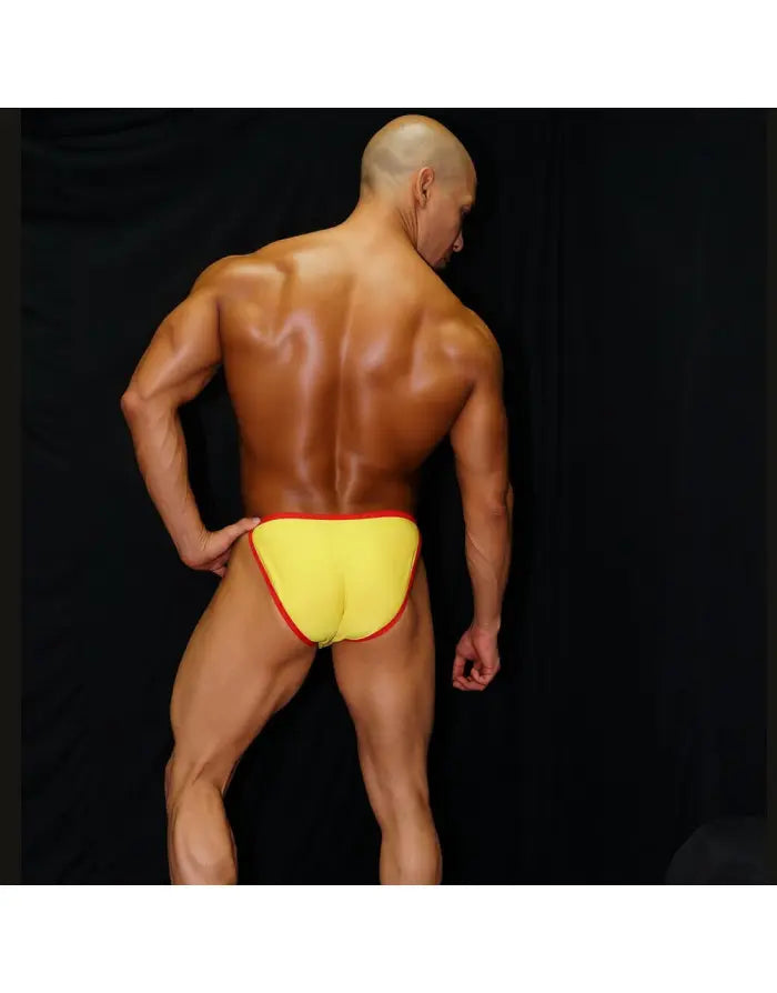 Men's bikini underwear in yellow with red trim shown on a model from the back by Arroyman.