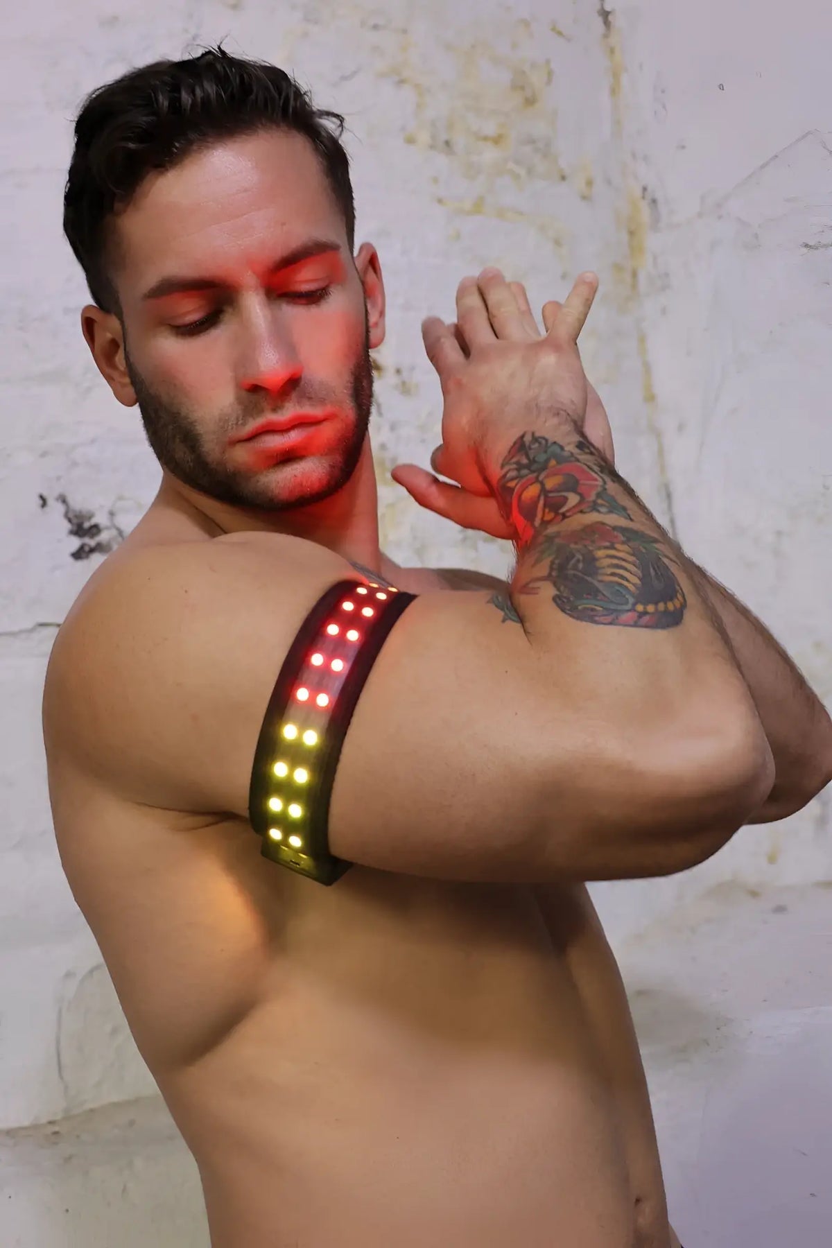 Black led soundwave armband with red and yellow lights designed for fitness and visibility during workouts