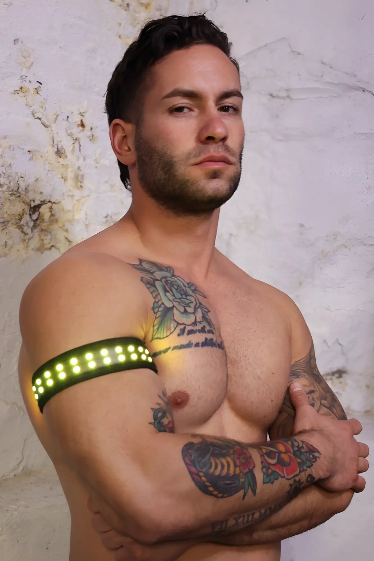 Soundwave armband with green led light-up feature worn on the upper arm for visibility and style
